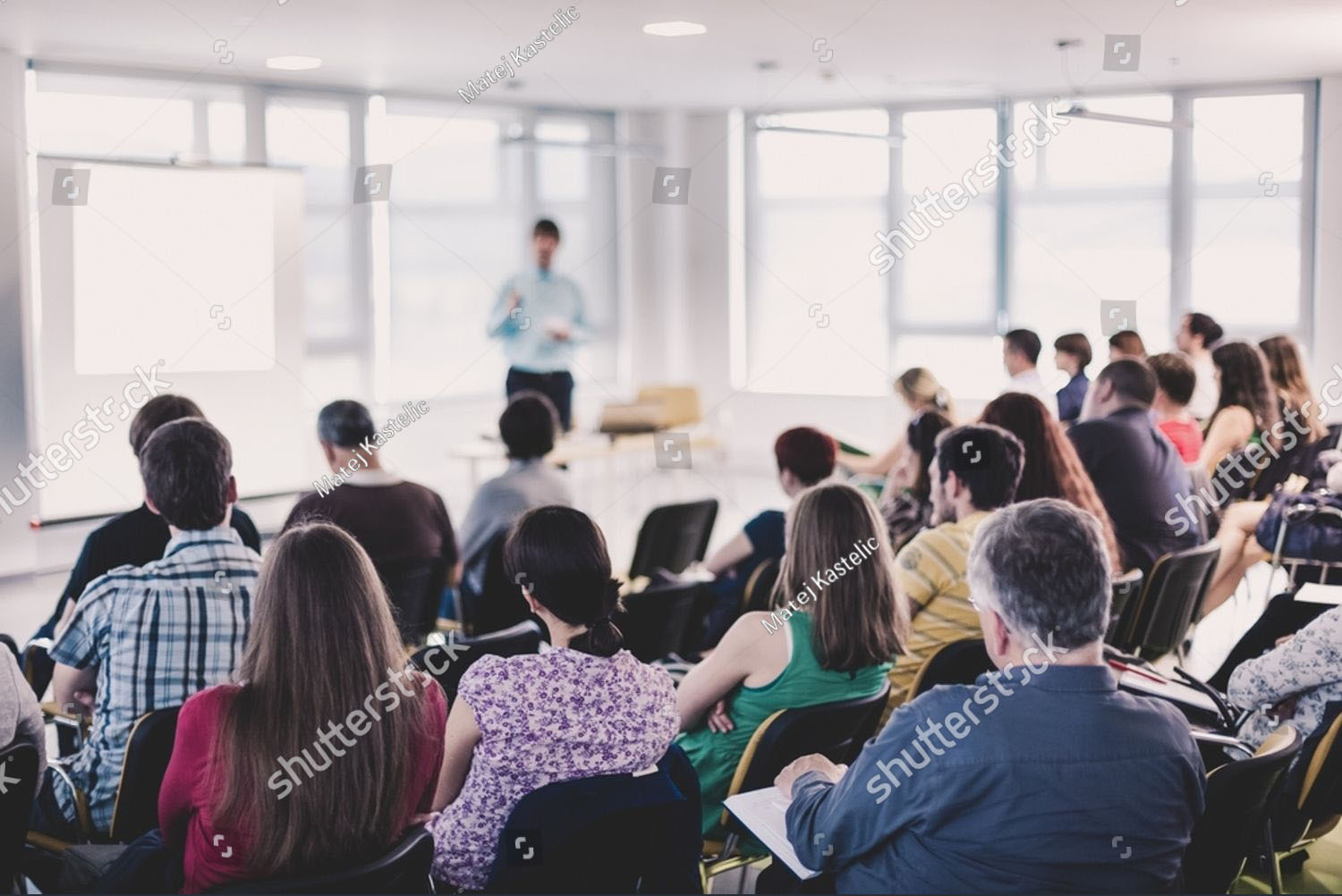 stock-photo-business-and-entrepreneurship-symposium-speaker-giving-a-talk-at-business-meeting-audience-in-2509295269